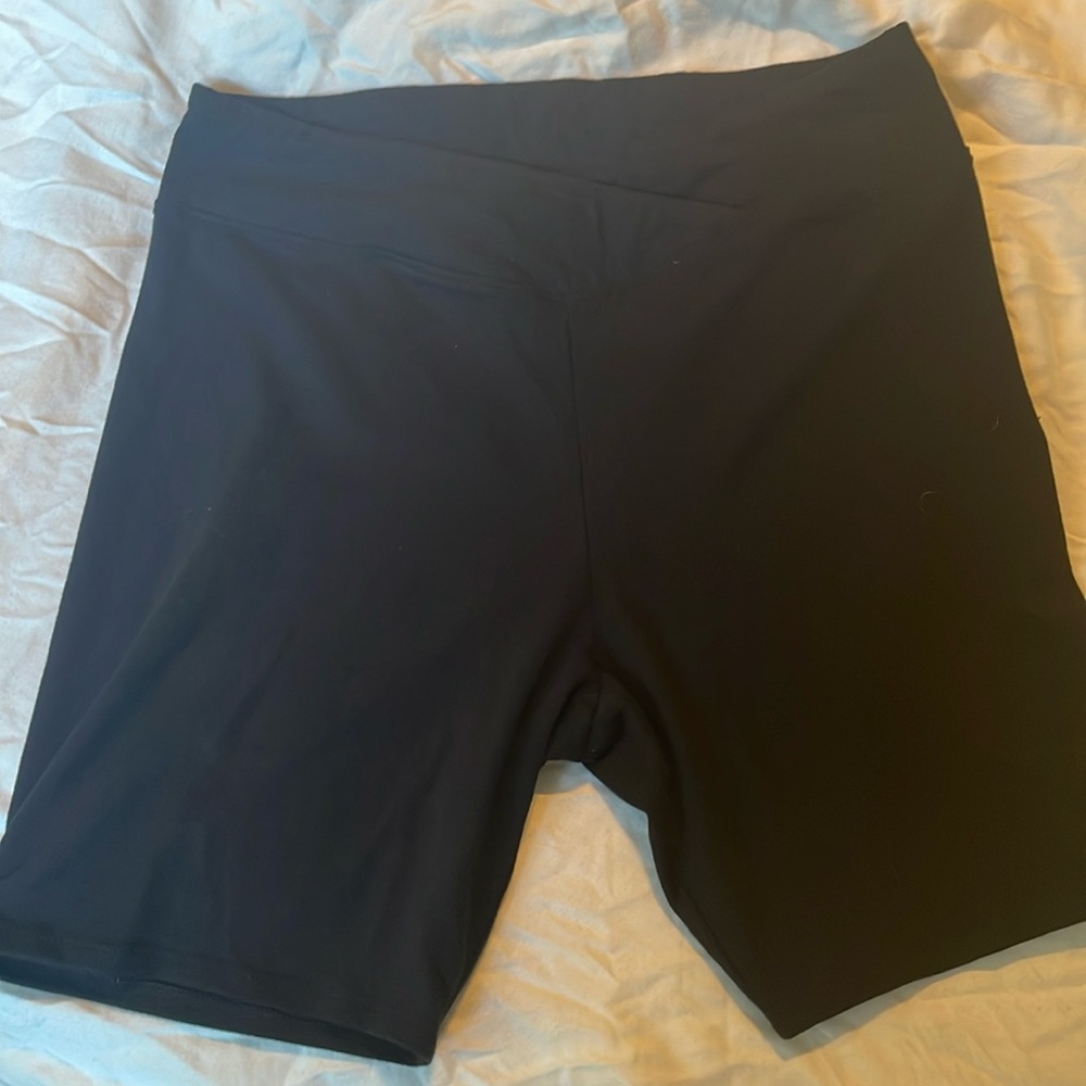 Black biker shorts. Criss cross front. 6.5” inseam